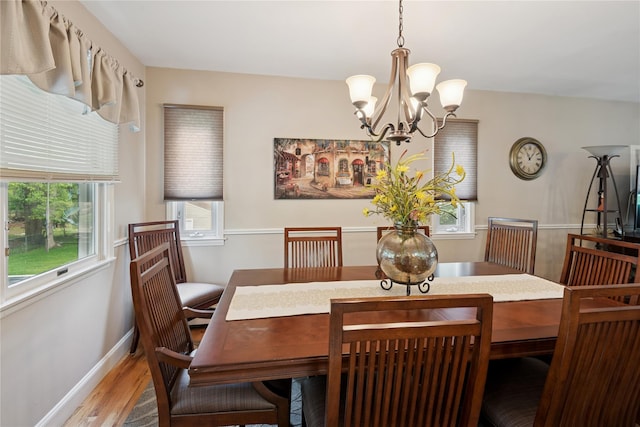 40 Dillmont Dr, Smithtown, NY 11787 - dining room featuring a chandelier, healthy amount of natural light, and light wood-type flooring