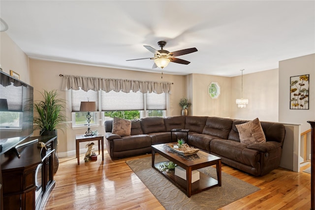 40 Dillmont Dr, Smithtown, NY 11787 - living area with a ceiling fan, a chandelier, and light wood-style floors