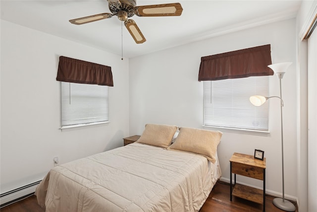40 Dillmont Dr, Smithtown, NY 11787 - bedroom with baseboard heating, wood finished floors, ceiling fan, and multiple windows