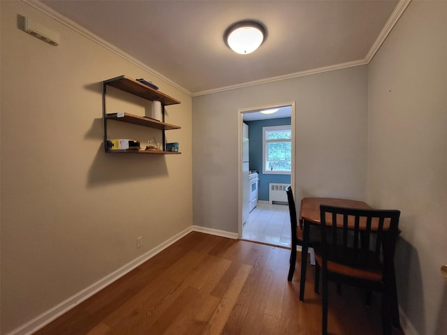 224-23 Kingsbury Ave Unit B, Oakland Gardens, NY 11364 - dining space with radiator heating unit, wood finished floors, and crown molding