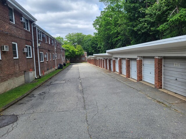 224-23 Kingsbury Ave Unit B, Oakland Gardens, NY 11364 - view of asphalt road featuring community garages