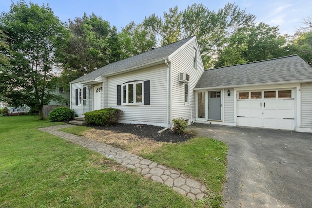 68 Henmond Blvd, Poughkeepsie, NY 12603 - view of front of home with an attached garage, asphalt driveway, roof with shingles, and a front lawn