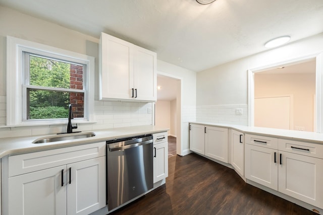 68 Henmond Blvd, Poughkeepsie, NY 12603 - kitchen with stainless steel dishwasher, dark wood-style floors, light countertops, and white cabinetry