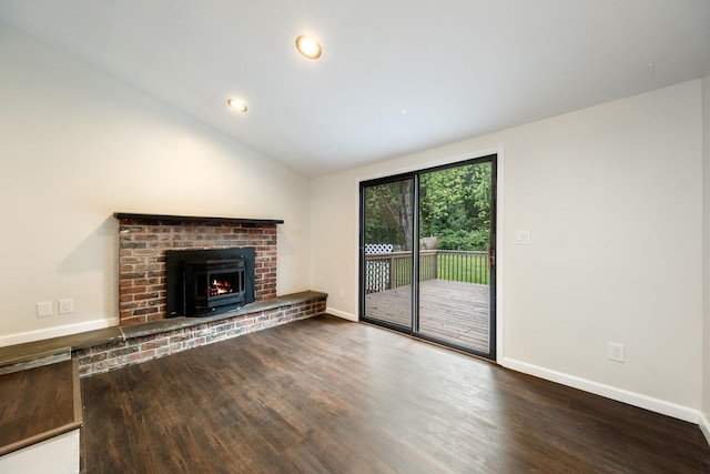 68 Henmond Blvd, Poughkeepsie, NY 12603 - unfurnished living room with wood finished floors, a brick fireplace, vaulted ceiling, and recessed lighting