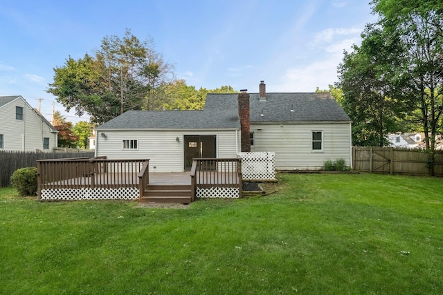 68 Henmond Blvd, Poughkeepsie, NY 12603 - rear view of property with a fenced backyard, a chimney, a deck, and a shingled roof