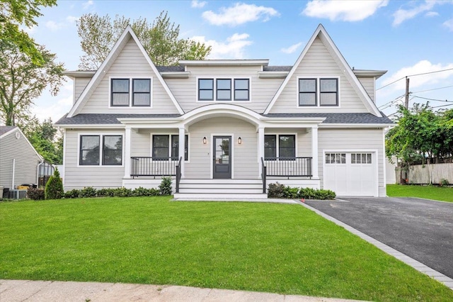 4 Haven Ln, Old Bethpage, NY 11804 - shingle-style home with a porch, an attached garage, driveway, and a front lawn