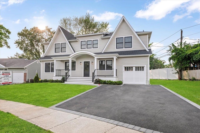 4 Haven Ln, Old Bethpage, NY 11804 - view of front facade with driveway, a porch, a garage, and a shingled roof