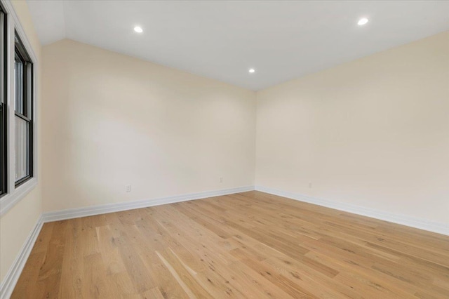 4 Haven Ln, Old Bethpage, NY 11804 - spare room with light wood-type flooring, recessed lighting, and vaulted ceiling