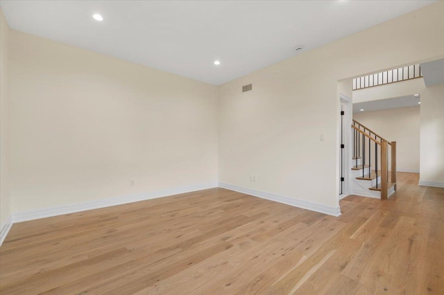 4 Haven Ln, Old Bethpage, NY 11804 - empty room featuring light wood-style floors, stairway, and recessed lighting