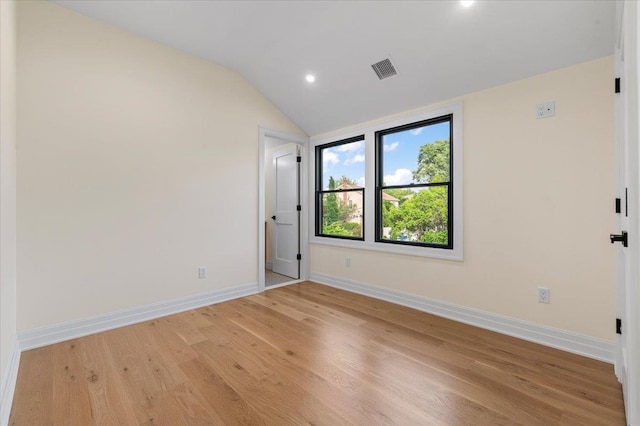4 Haven Ln, Old Bethpage, NY 11804 - empty room with light wood finished floors, recessed lighting, and vaulted ceiling