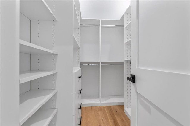 4 Haven Ln, Old Bethpage, NY 11804 - walk in closet featuring wood finished floors