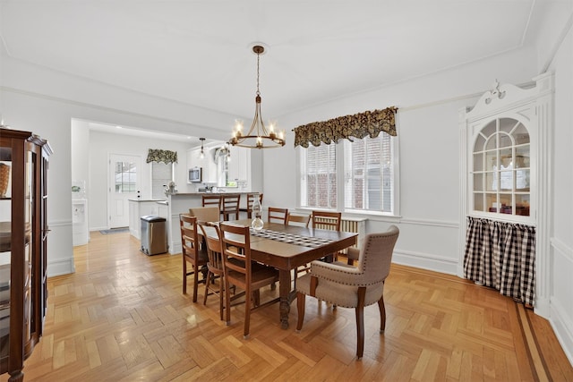 131 E 238th St, Bronx, NY 10470 - dining room with a chandelier and baseboards