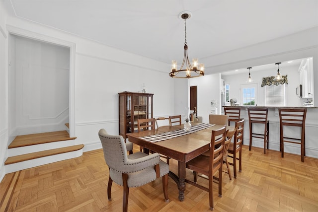 131 E 238th St, Bronx, NY 10470 - dining room featuring a chandelier and stairway