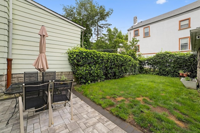 131 E 238th St, Bronx, NY 10470 - view of green lawn featuring a patio area and outdoor dining space
