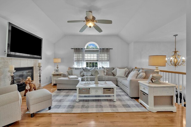 450 Mt Orange Rd, Middletown, NY 10940 - living area with vaulted ceiling, a chandelier, ceiling fan, wood finished floors, and a fireplace