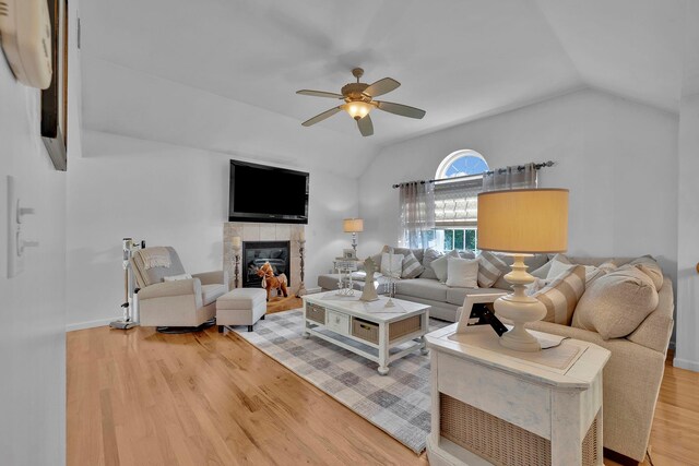 450 Mt Orange Rd, Middletown, NY 10940 - living area with lofted ceiling, ceiling fan, light wood-style floors, and a tiled fireplace