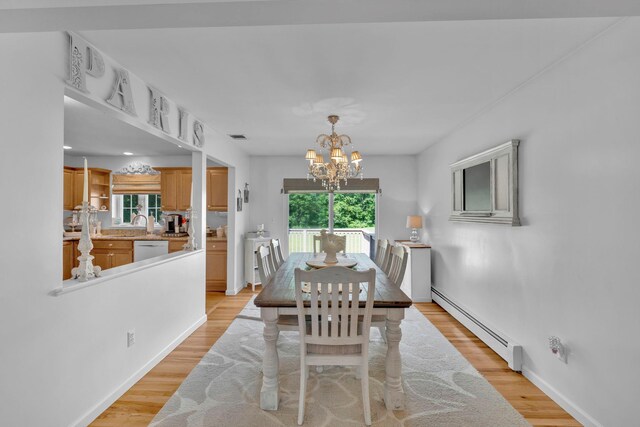 450 Mt Orange Rd, Middletown, NY 10940 - dining room featuring baseboard heating, plenty of natural light, a chandelier, and light wood finished floors