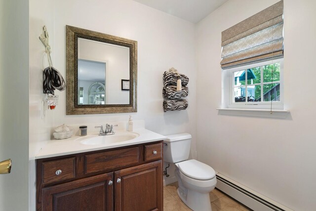 450 Mt Orange Rd, Middletown, NY 10940 - half bath with a baseboard heating unit, vanity, and tile patterned flooring