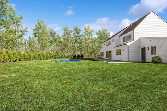 10 Broadwood Ct, Wainscott, NY 11975 - view of green lawn with a patio area