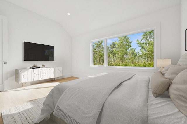 10 Broadwood Ct, Wainscott, NY 11975 - bedroom with wood finished floors, vaulted ceiling, and recessed lighting