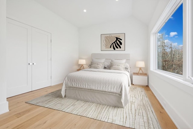 10 Broadwood Ct, Wainscott, NY 11975 - bedroom featuring vaulted ceiling, light wood-style floors, and recessed lighting