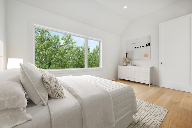 10 Broadwood Ct, Wainscott, NY 11975 - bedroom with light wood-type flooring, vaulted ceiling, and recessed lighting