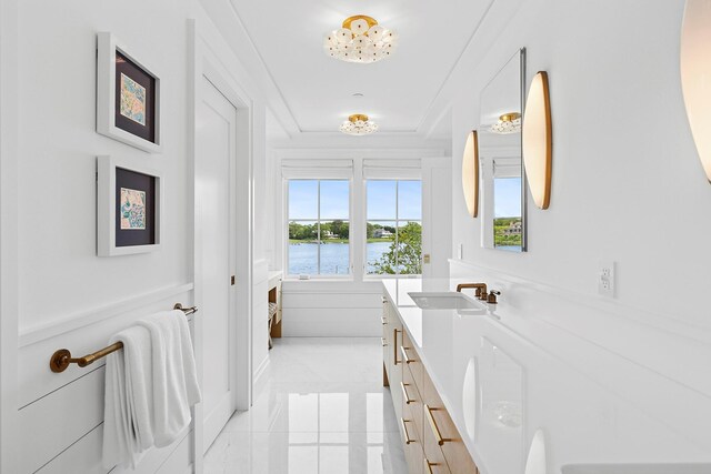 801 Montauk Hwy, Westhampton Beach, NY 11978 - full bathroom with vanity, a water view, tile patterned flooring, and a raised ceiling
