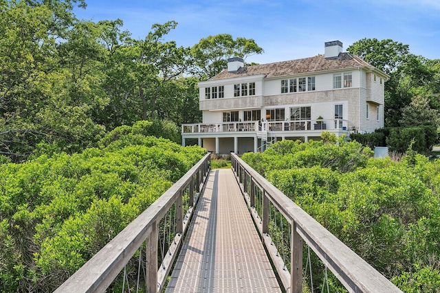 801 Montauk Hwy, Westhampton Beach, NY 11978 - back of house with a chimney