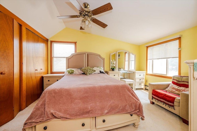 686 Barnes Ave, Baldwin, NY 11510 - bedroom with light carpet, vaulted ceiling, baseboard heating, and ceiling fan