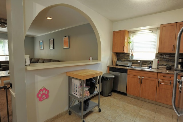 129-1 S Highland Ave Unit B6, Ossining, NY 10562 - kitchen with dishwasher, tasteful backsplash, plenty of natural light, arched walkways, and ornamental molding