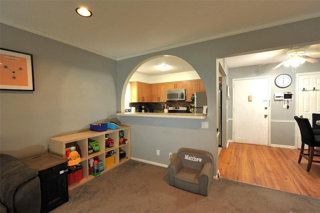 129-1 S Highland Ave Unit B6, Ossining, NY 10562 - playroom featuring crown molding, ceiling fan, arched walkways, and recessed lighting