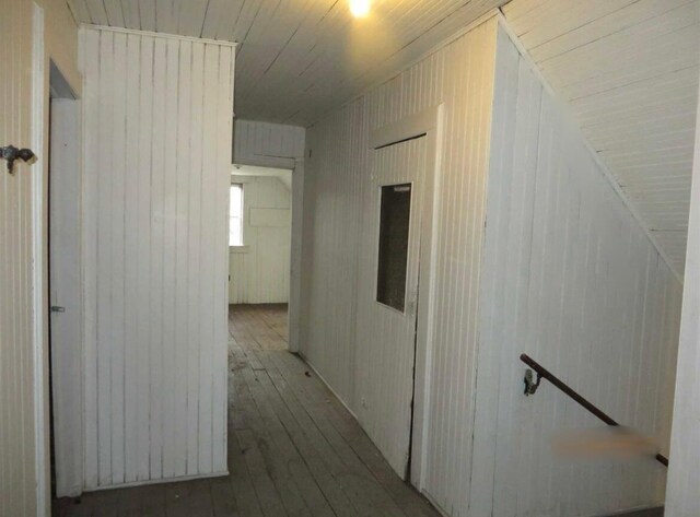 306 Church St, Poughkeepsie, NY 12601 - hall with hardwood / wood-style flooring, wood walls, and wooden ceiling