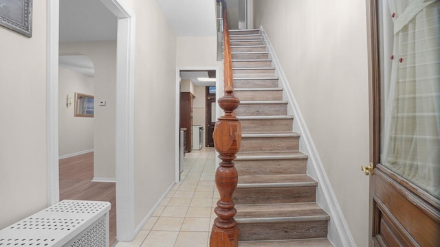 868 Morris Park Ave, Bronx, NY 10462 - staircase with arched walkways and tile patterned floors