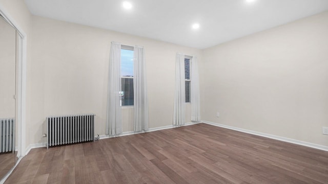 868 Morris Park Ave, Bronx, NY 10462 - empty room with radiator, wood finished floors, and recessed lighting