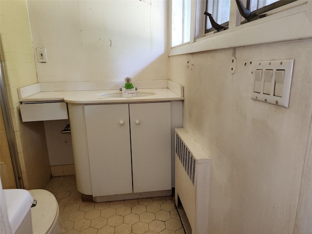 2 High Pne, Glen Cove, NY 11542 - bathroom featuring radiator heating unit, vanity, and tile patterned floors