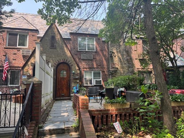 33-42 70th St, Jackson Heights, NY 11372 - view of front of property with brick siding and a high end roof