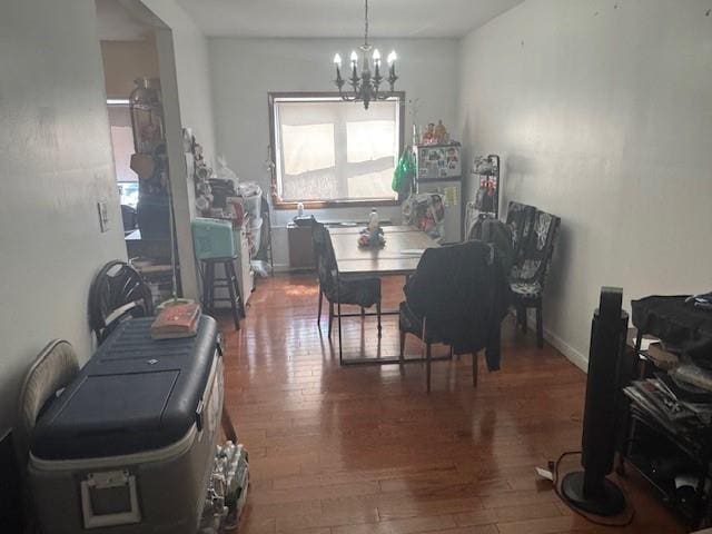 33-42 70th St, Jackson Heights, NY 11372 - dining room featuring a chandelier and wood finished floors