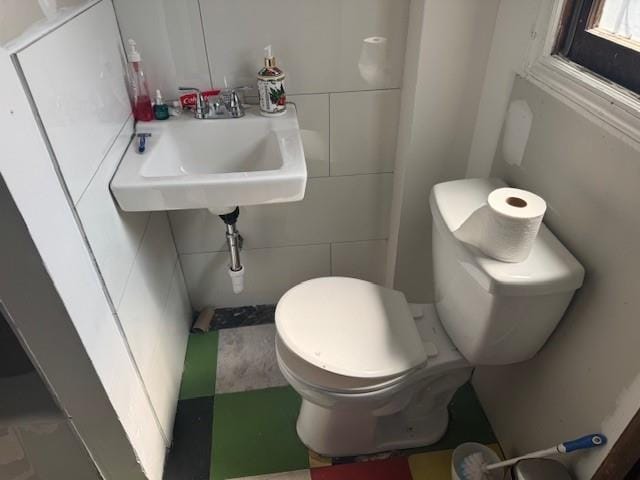 33-42 70th St, Jackson Heights, NY 11372 - half bathroom featuring tile walls and toilet