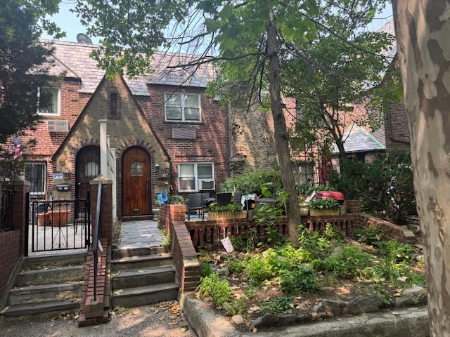 33-42 70th St, Jackson Heights, NY 11372 - english style home featuring brick siding