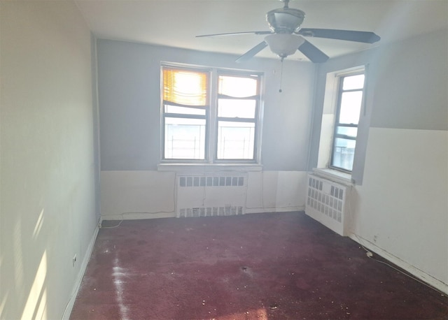 2866 Marion Ave Unit 4C, Bronx, NY 10458 - carpeted empty room featuring radiator heating unit and ceiling fan