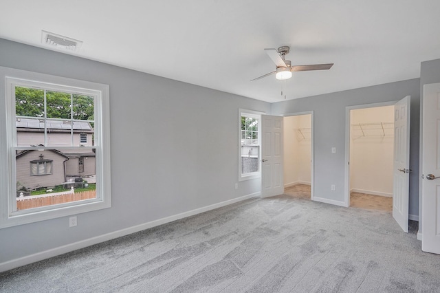 159 Mohawk St, Ronkonkoma, NY 11779 - unfurnished bedroom with carpet, a walk in closet, ceiling fan, and a closet