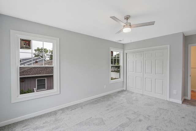 159 Mohawk St, Ronkonkoma, NY 11779 - unfurnished bedroom with carpet, a closet, and a ceiling fan
