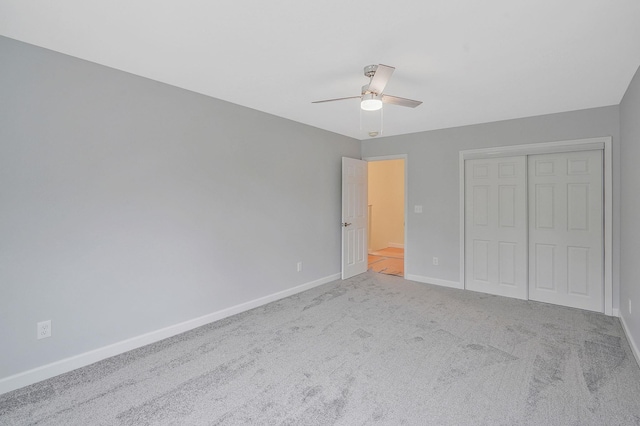 159 Mohawk St, Ronkonkoma, NY 11779 - unfurnished bedroom with carpet flooring, a closet, and a ceiling fan