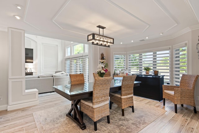 62 Hamlet Dr, Commack, NY 11725 - dining room featuring healthy amount of natural light, light wood-style flooring, ornamental molding, a chandelier, and recessed lighting