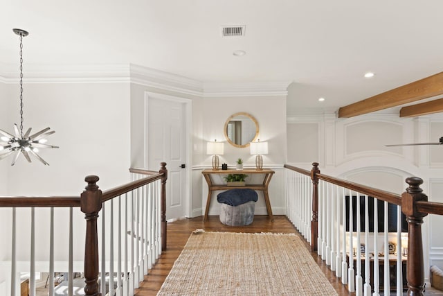 62 Hamlet Dr, Commack, NY 11725 - hall with a chandelier, wood finished floors, recessed lighting, an upstairs landing, and crown molding