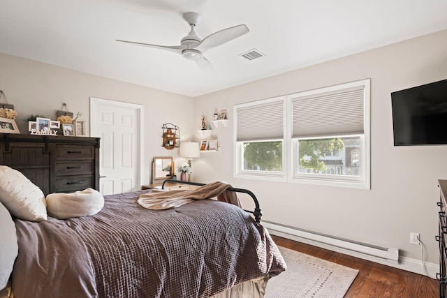 62 Hamlet Dr, Commack, NY 11725 - bedroom featuring a baseboard heating unit, wood finished floors, and ceiling fan