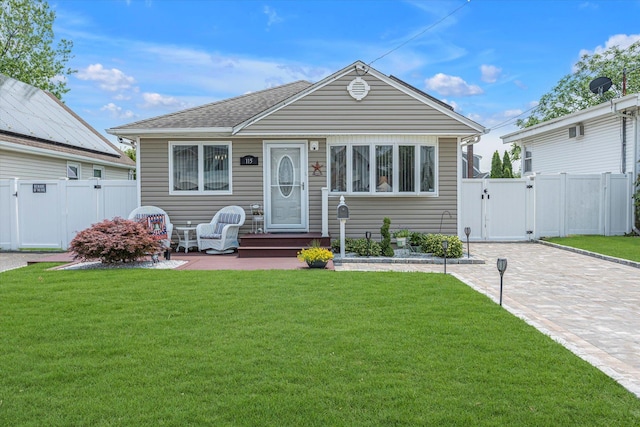 115 W Granada Ave, Lindenhurst, NY 11757 - view of front facade with a gate, a shingled roof, and entry steps