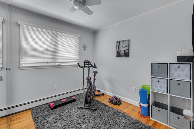 115 W Granada Ave, Lindenhurst, NY 11757 - exercise room featuring a baseboard radiator, a ceiling fan, crown molding, and wood finished floors
