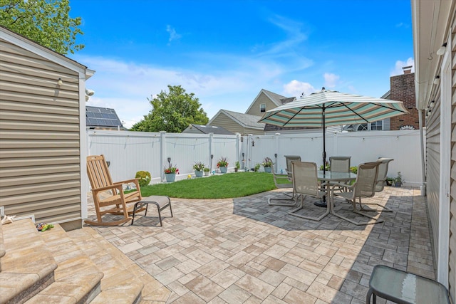 115 W Granada Ave, Lindenhurst, NY 11757 - fenced backyard with a patio area and outdoor dining space