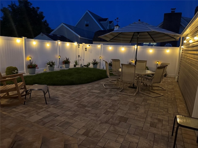 115 W Granada Ave, Lindenhurst, NY 11757 - patio at night with a patio area and outdoor dining space